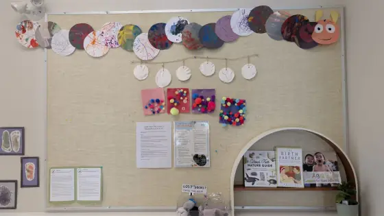 The Caterpillar Room bulletin board with family updates